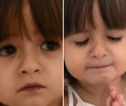 Criança une as mãos e começa a rezar, pedindo o fim do coronavírus (Foto: Reprodução)